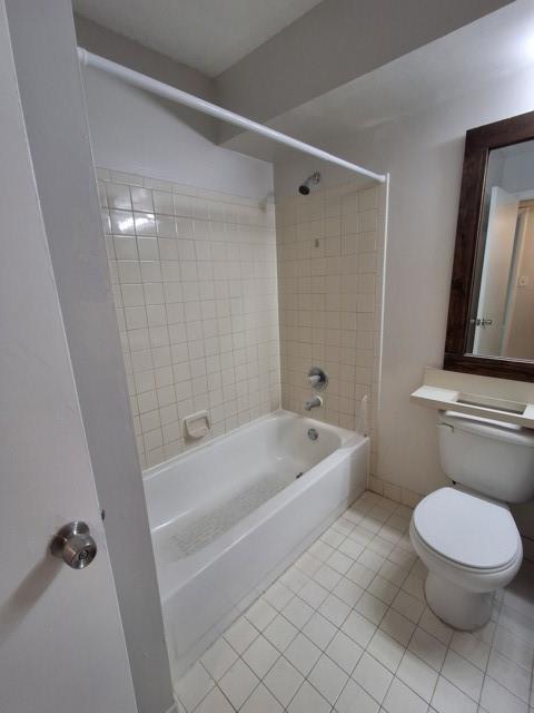 741 Lyons Road, Unit 17106 Coconut Creek, FL 33063 - Photo 14 of 28 a bathroom with a sink a toilet a tub and shower