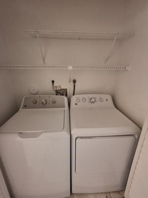 741 Lyons Road, Unit 17106 Coconut Creek, FL 33063 - Photo 16 of 28 a utility room with dryer and washer