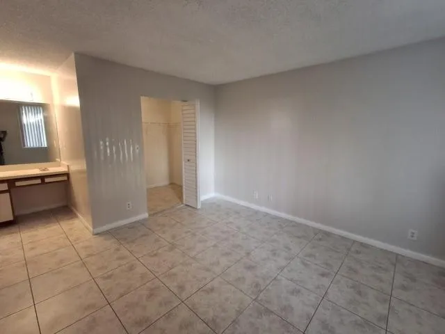 a view of a kitchen with cabinets
