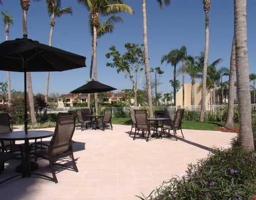 an outdoor space with patio and outdoor seating