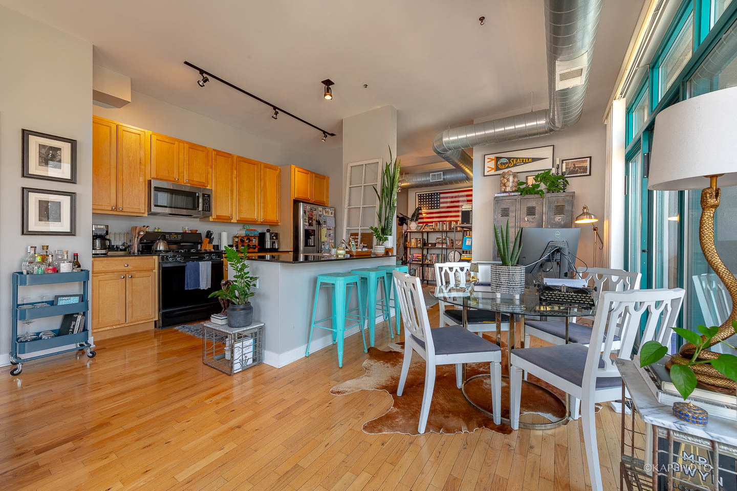 910 West Madison Street, Unit 906E Chicago, IL 60607 - Photo 12 of 26 a dining room with furniture and wooden floor