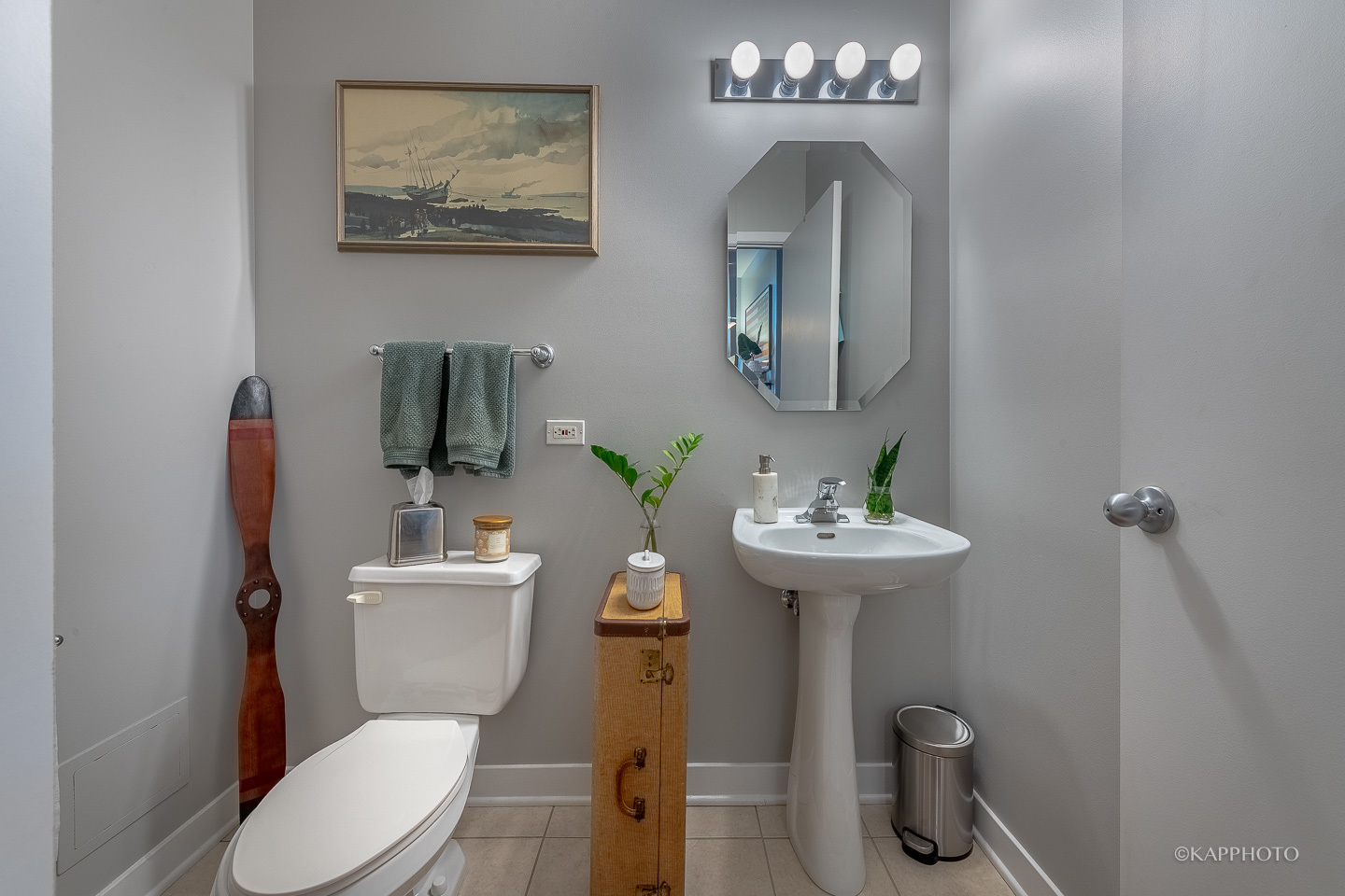 910 West Madison Street, Unit 906E Chicago, IL 60607 - Photo 15 of 26 a bathroom with a toilet sink and mirror