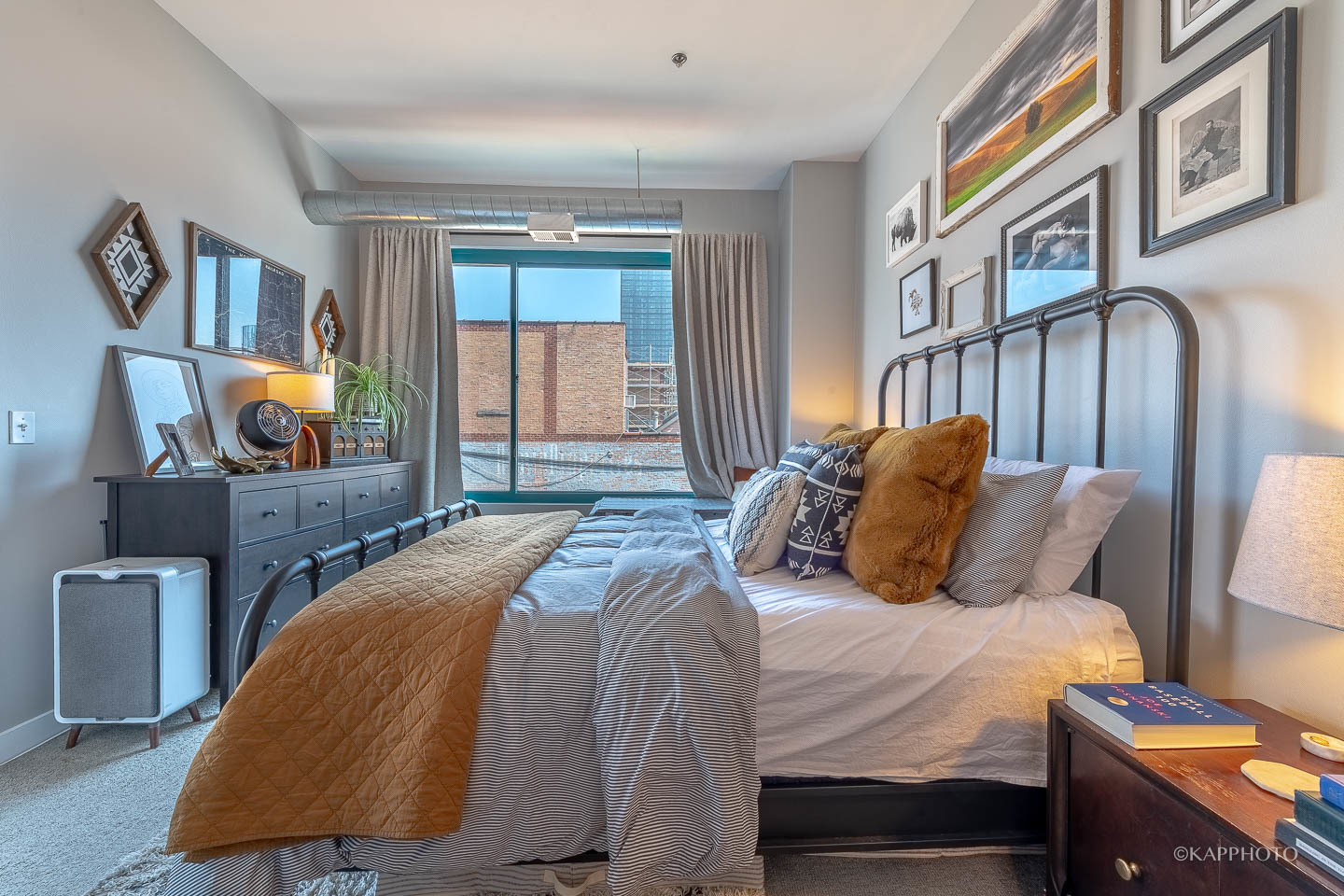 910 West Madison Street, Unit 906E Chicago, IL 60607 - Photo 17 of 26 a bedroom with a bed dresser and a window