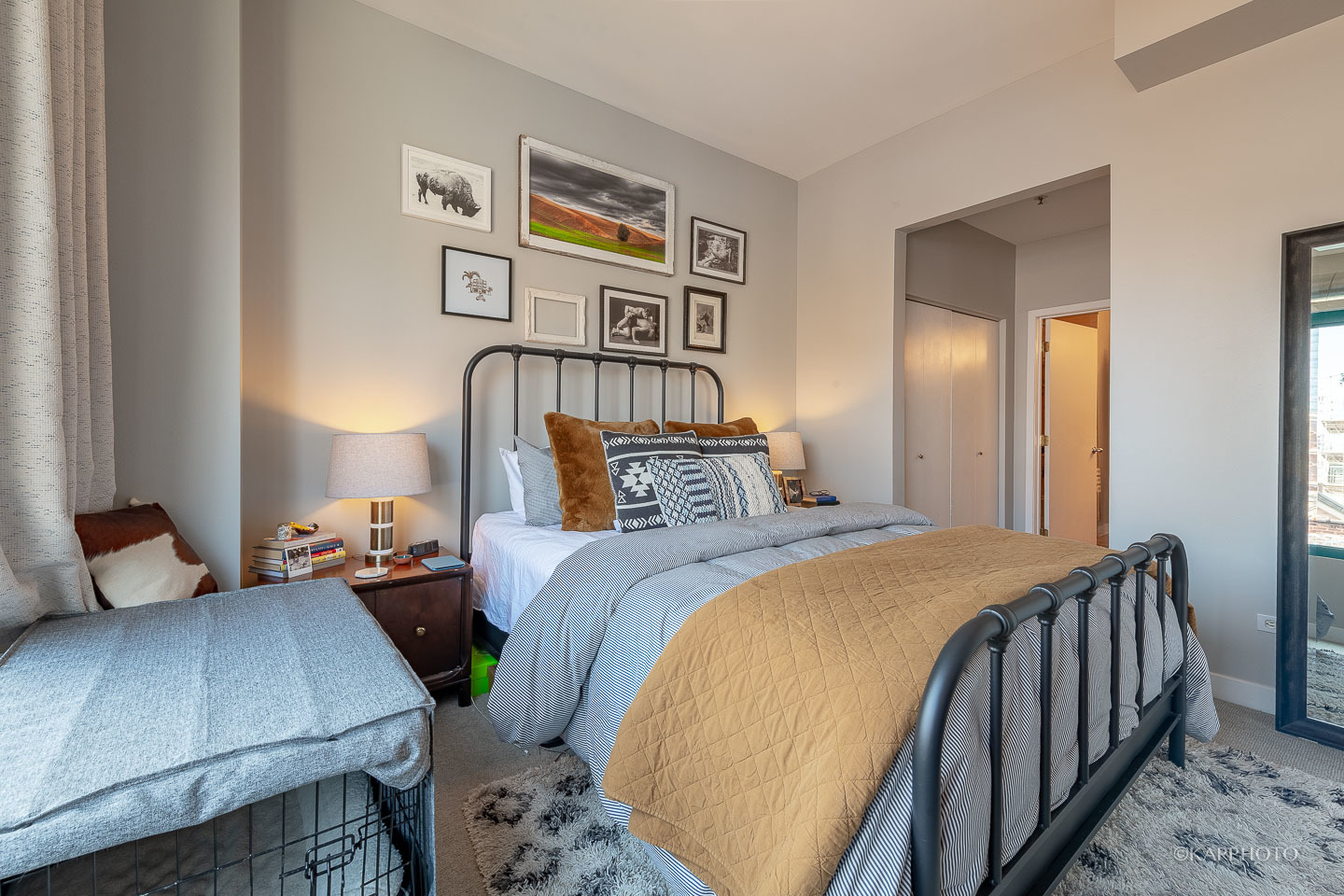 910 West Madison Street, Unit 906E Chicago, IL 60607 - Photo 19 of 26 a bedroom with bed and wooden floor