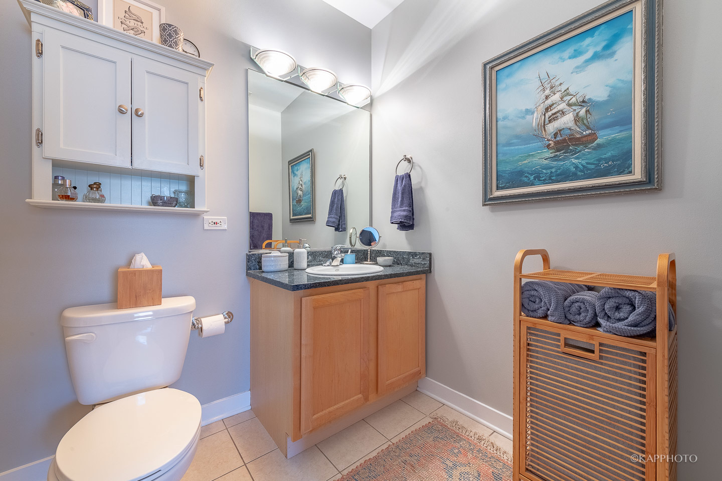 910 West Madison Street, Unit 906E Chicago, IL 60607 - Photo 22 of 26 a bathroom with a toilet a sink and a mirror