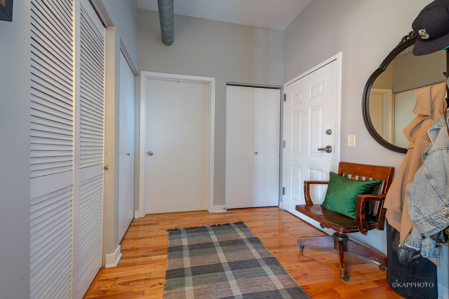 910 West Madison Street, Unit 906E Chicago, IL 60607 - Photo 3 of 26 a bedroom with a bed and a mirror