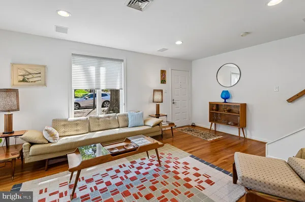 a living room with furniture and a rug