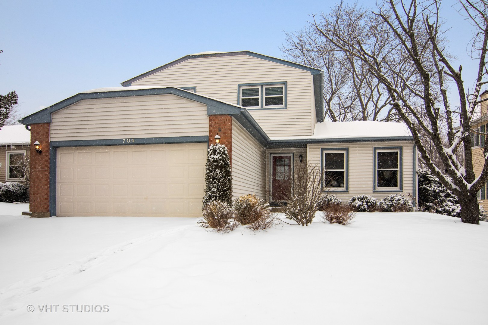 a front view of a house with yard