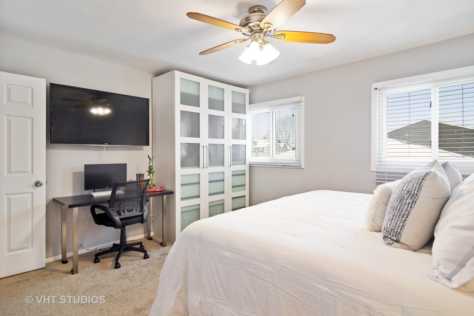 704 Cherry Valley Road Vernon Hills, IL 60061 - Photo 11 of 21 a bedroom with a bed and a flat screen tv