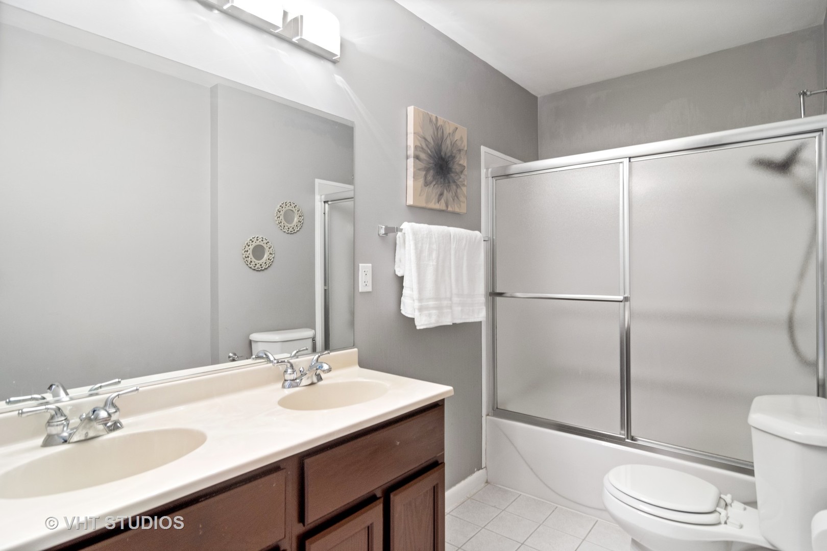 704 Cherry Valley Road Vernon Hills, IL 60061 - Photo 15 of 21 a bathroom with a sink toilet and shower