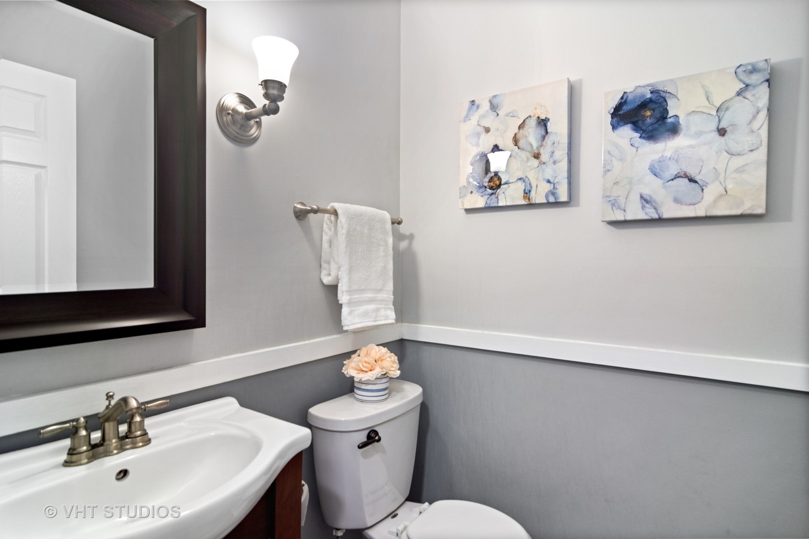 704 Cherry Valley Road Vernon Hills, IL 60061 - Photo 16 of 21 a bathroom with a toilet a sink and mirror