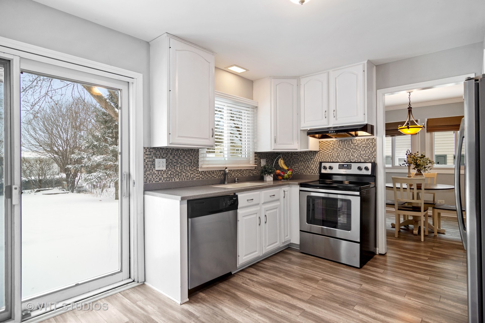 704 Cherry Valley Road Vernon Hills, IL 60061 - Photo 5 of 21 a kitchen with stainless steel appliances granite countertop a stove a sink and a refrigerator