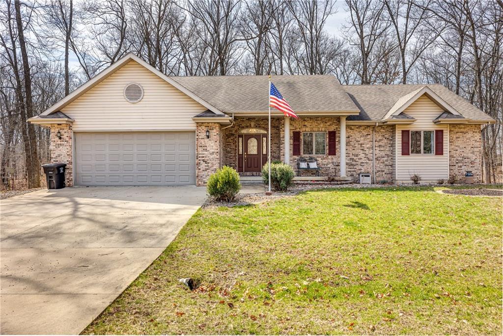 14611 Dan Lane Effingham, IL 62401 - Photo 1 of 1 a front view of a house with a yard and garage