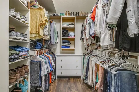 a bedroom with furniture and a window