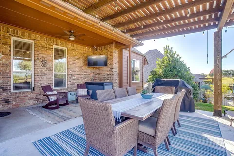 a living room with furniture fireplace and wooden floor