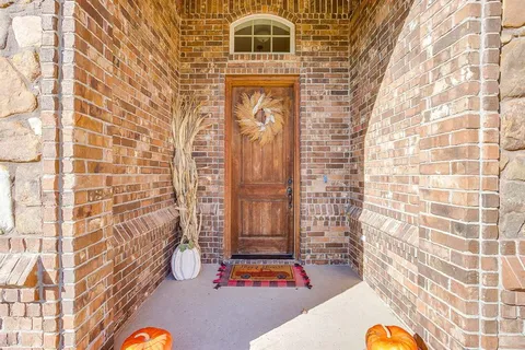 a view of hallway with cabinets