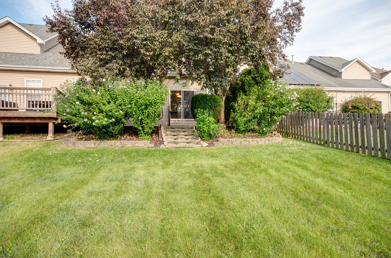 520 Frieh Drive Romeoville, IL 60446 - Photo 7 of 26 a view of a backyard with table and chairs and potted plants