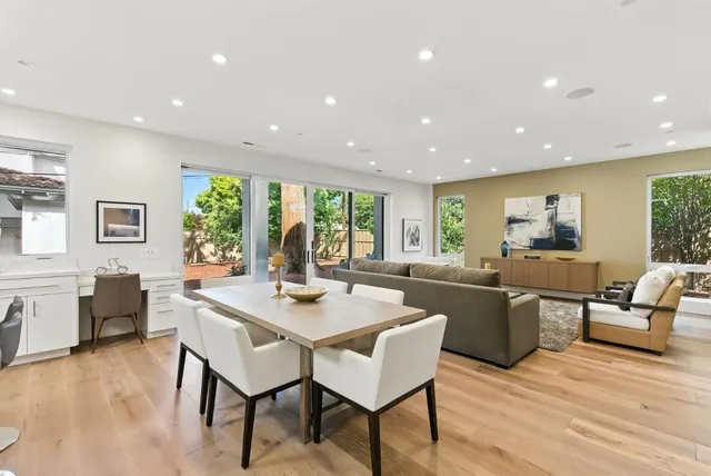 a view of a dining room with furniture window and wooden floor