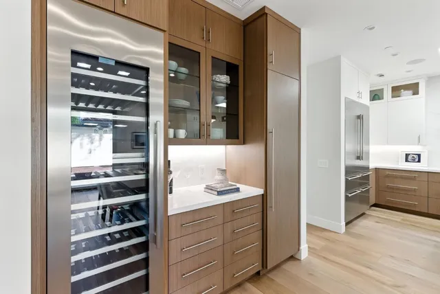 a kitchen with a refrigerator and a sink