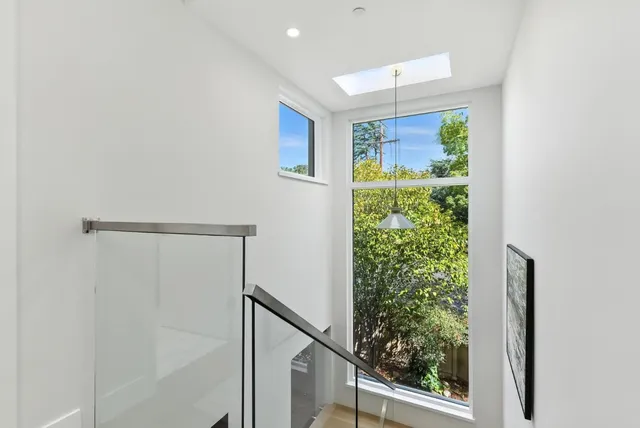 a view of a hallway with windows