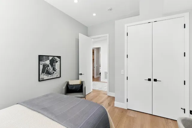 a bedroom with a bed and a shower