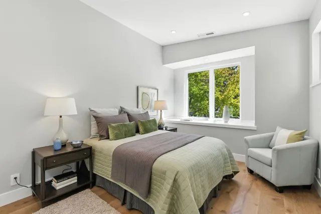 a bedroom with a bed and a couch