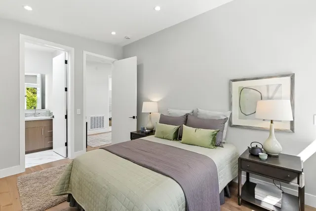 a bedroom with a bed and a dresser