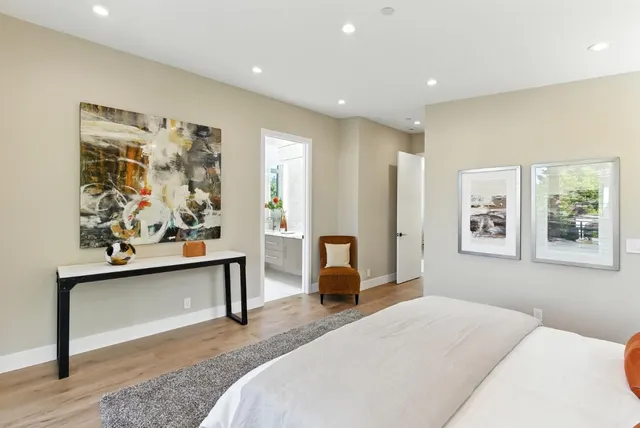 a bedroom with furniture and window