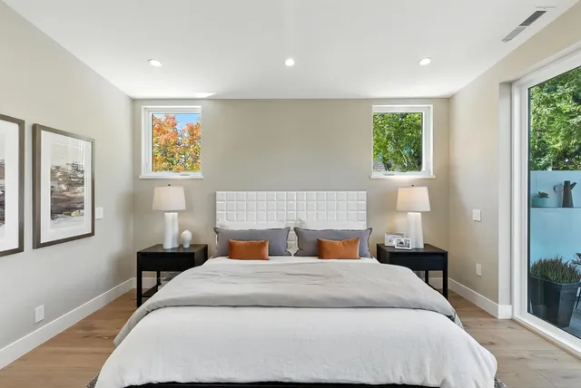 a bedroom with a large bed and a window