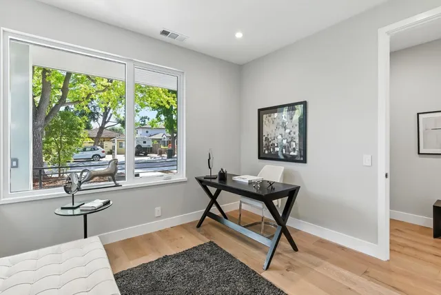 a view of a livingroom with furniture and a window