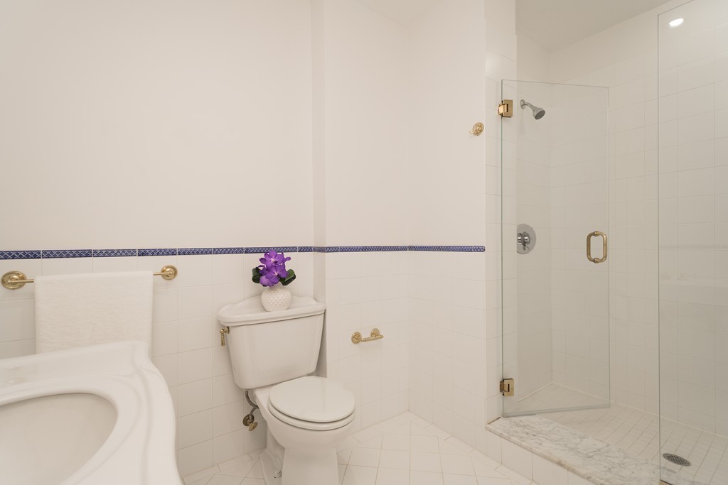 5 Chestnut Street, Unit 1 Boston, MA 02108 - Photo 11 of 14 a white toilet sitting next to a bathroom sink