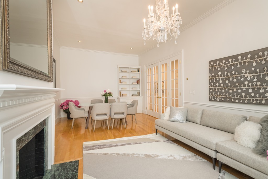 5 Chestnut Street, Unit 1 Boston, MA 02108 - Photo 2 of 14 a living room with furniture and a fireplace