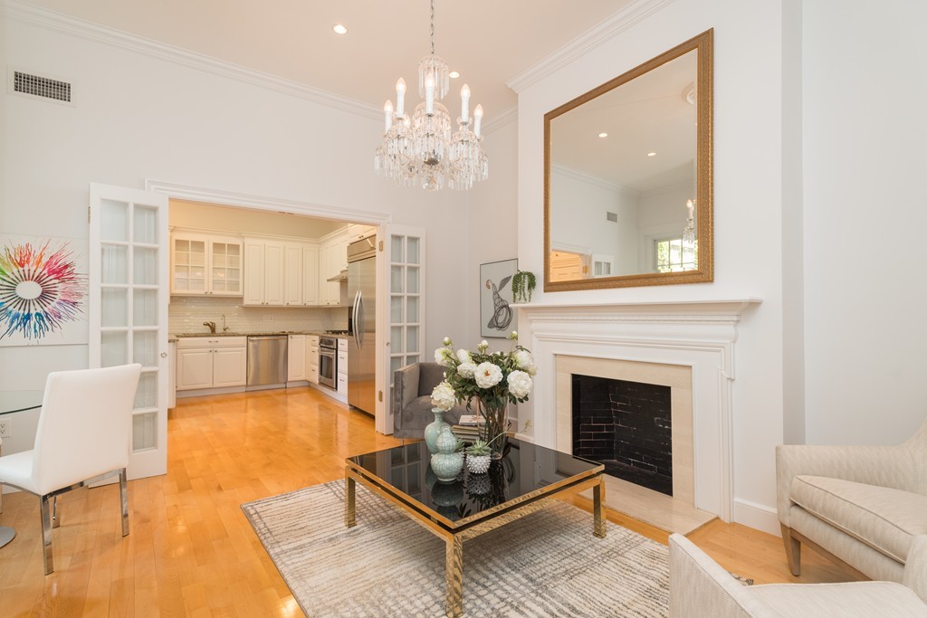 5 Chestnut Street, Unit 1 Boston, MA 02108 - Photo 4 of 14 a living room with furniture and a fireplace