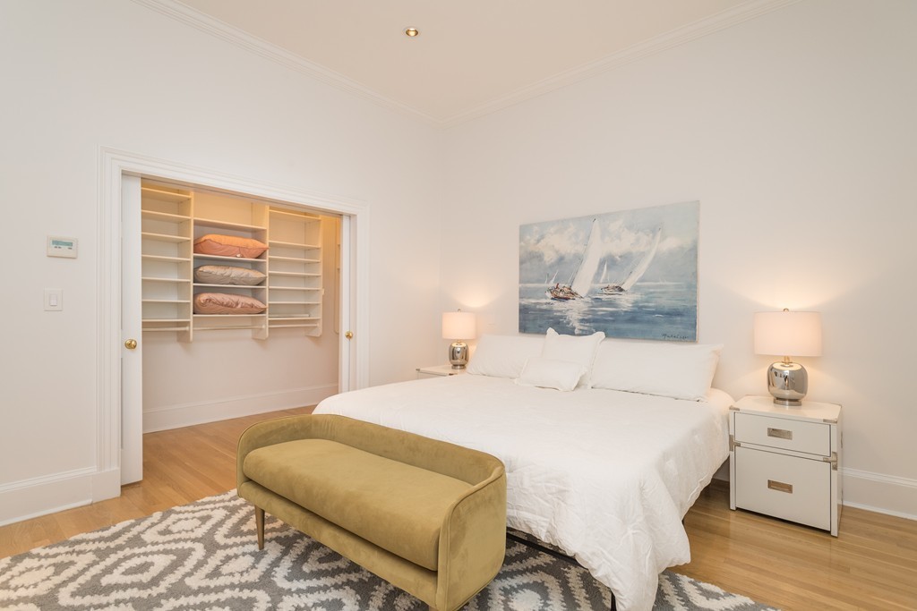 5 Chestnut Street, Unit 1 Boston, MA 02108 - Photo 8 of 14 a bedroom with a bed and a couch