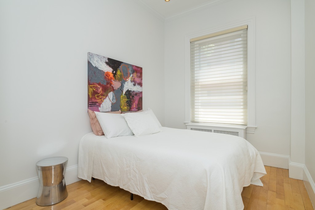 5 Chestnut Street, Unit 1 Boston, MA 02108 - Photo 9 of 14 a bedroom with a bed and a painting on the wall