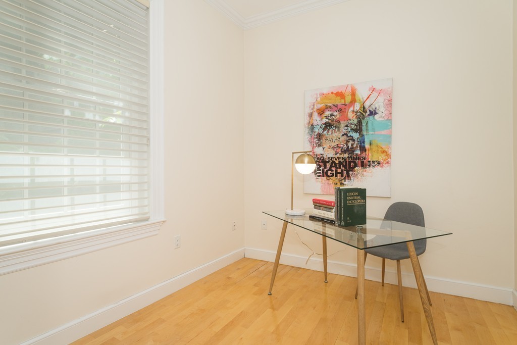 5 Chestnut Street, Unit 1 Boston, MA 02108 - Photo 10 of 14 a table and a vase of flowers sitting on a table