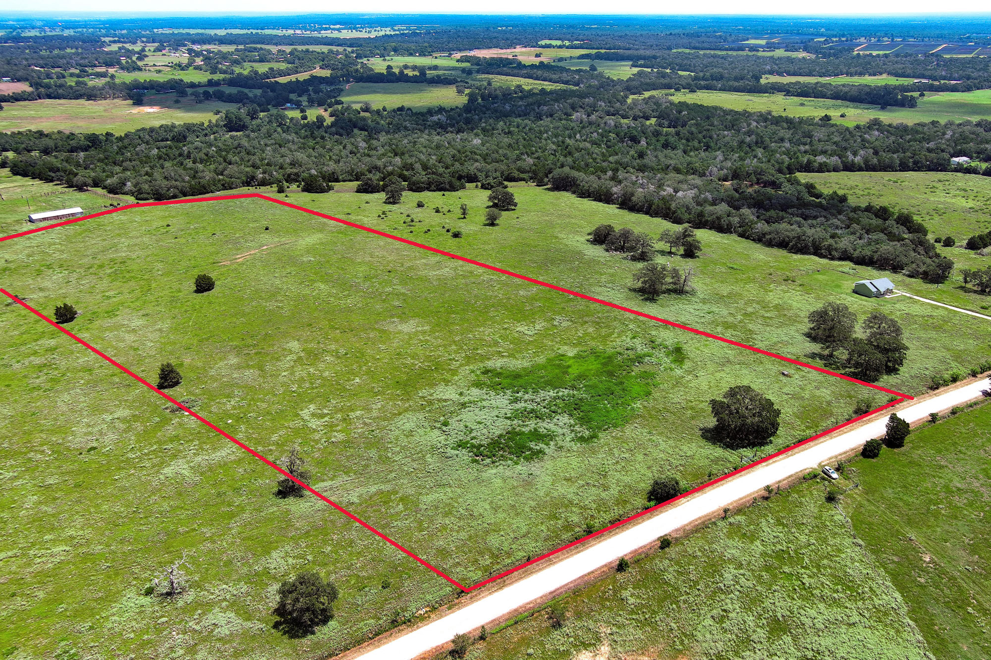 Tbd Hofferek Road Rosanky, TX 78953 - Photo 6 of 32 A vast, verdant expanse of land offers a rural panorama, ideal for building a secluded estate.