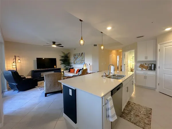 a kitchen with a sink and a stove top oven