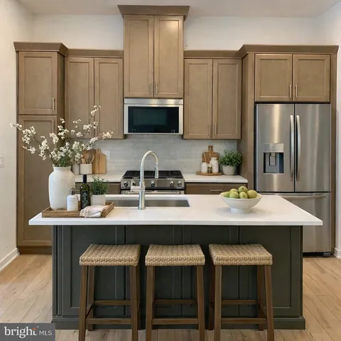 a kitchen with cabinets a counter and chairs