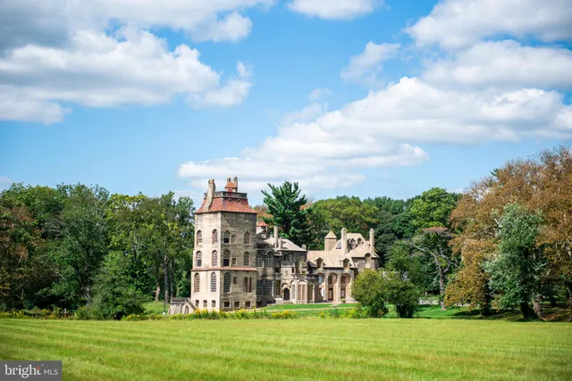 a view of a lake with swimming pool and red chair