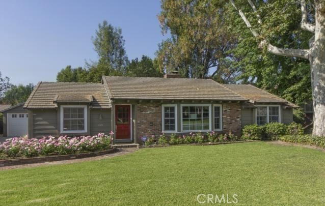 front view of a house with a garden