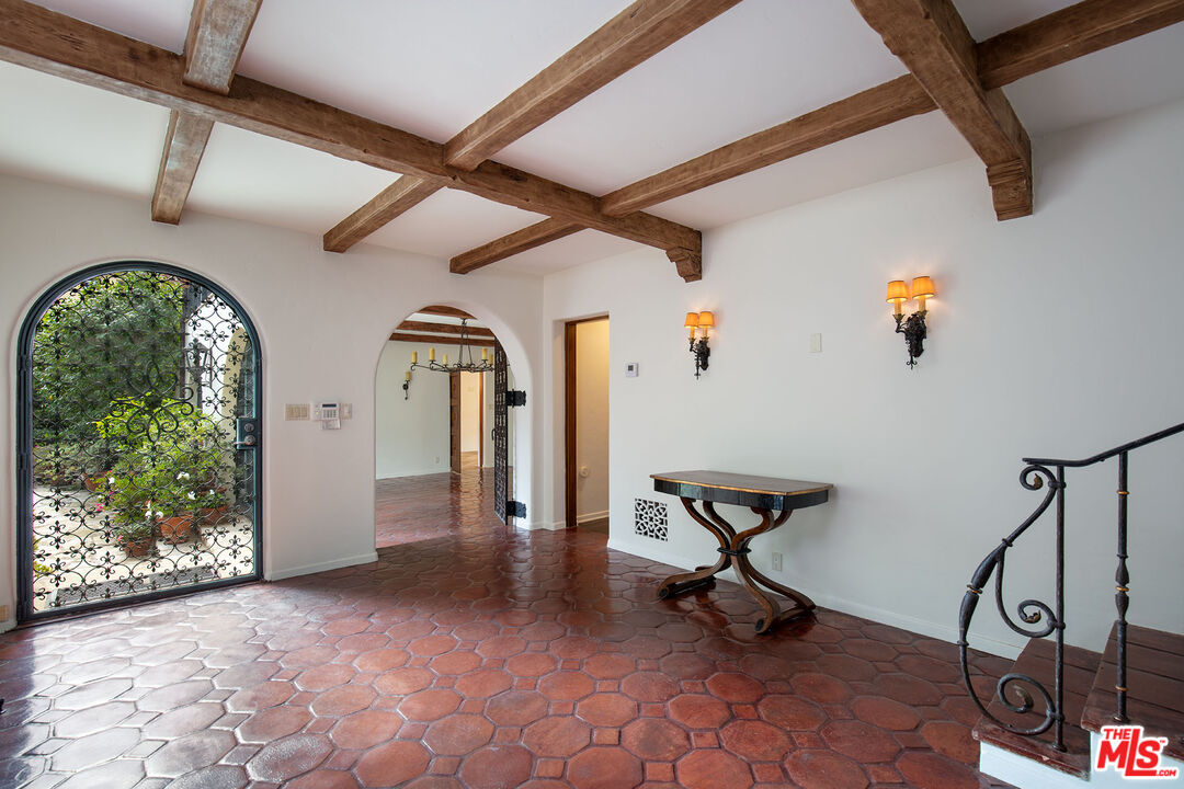 703 Walden Drive Beverly Hills, CA 90210 - Photo 5 of 22 a view of an entryway with wooden floor