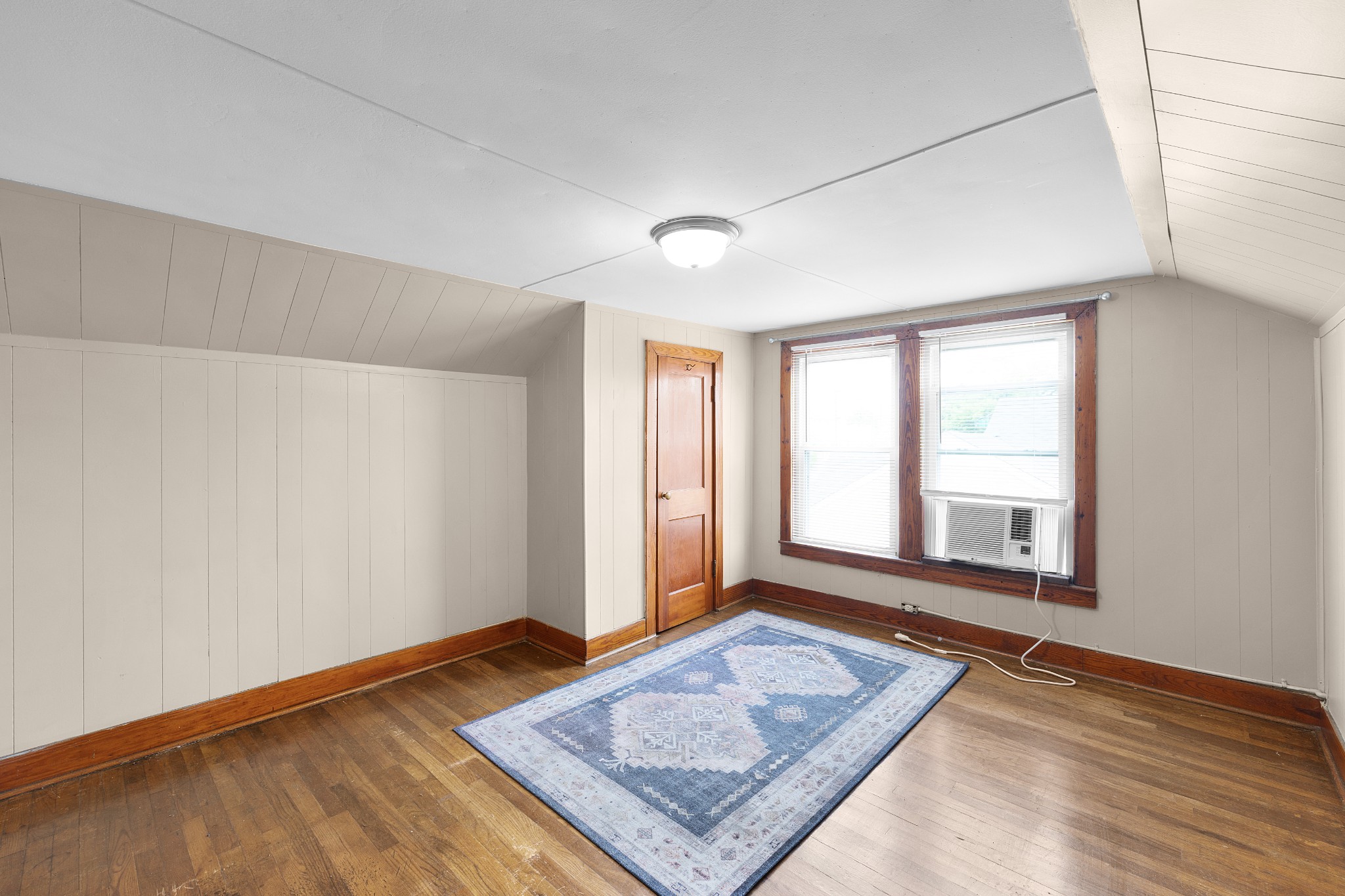 116 Summer Street Martin, TN 38237 - Photo 11 of 43 a view of an empty room with window and wooden floor