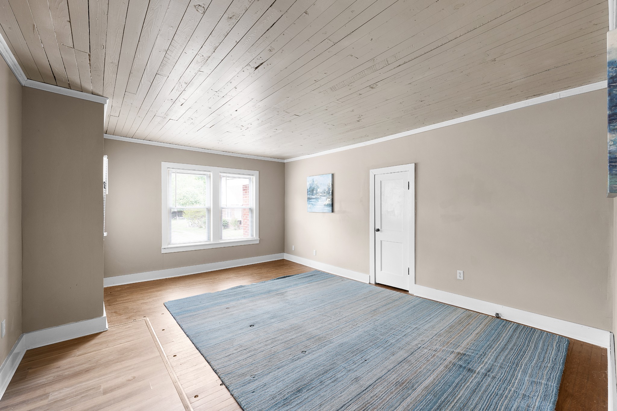 116 Summer Street Martin, TN 38237 - Photo 13 of 43 an empty room with wooden floor and windows