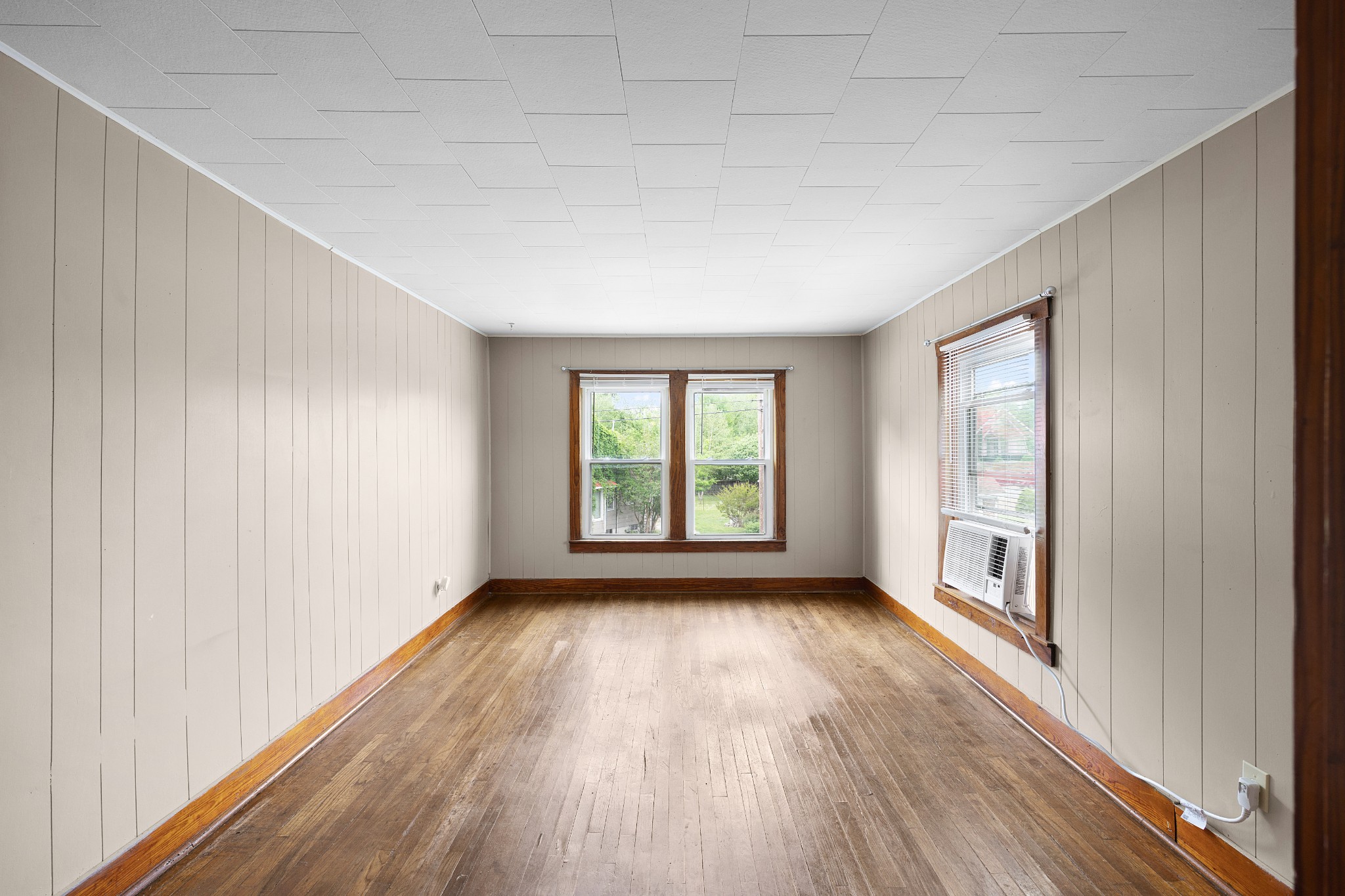 116 Summer Street Martin, TN 38237 - Photo 2 of 43 a view of an empty room with wooden floor and a window
