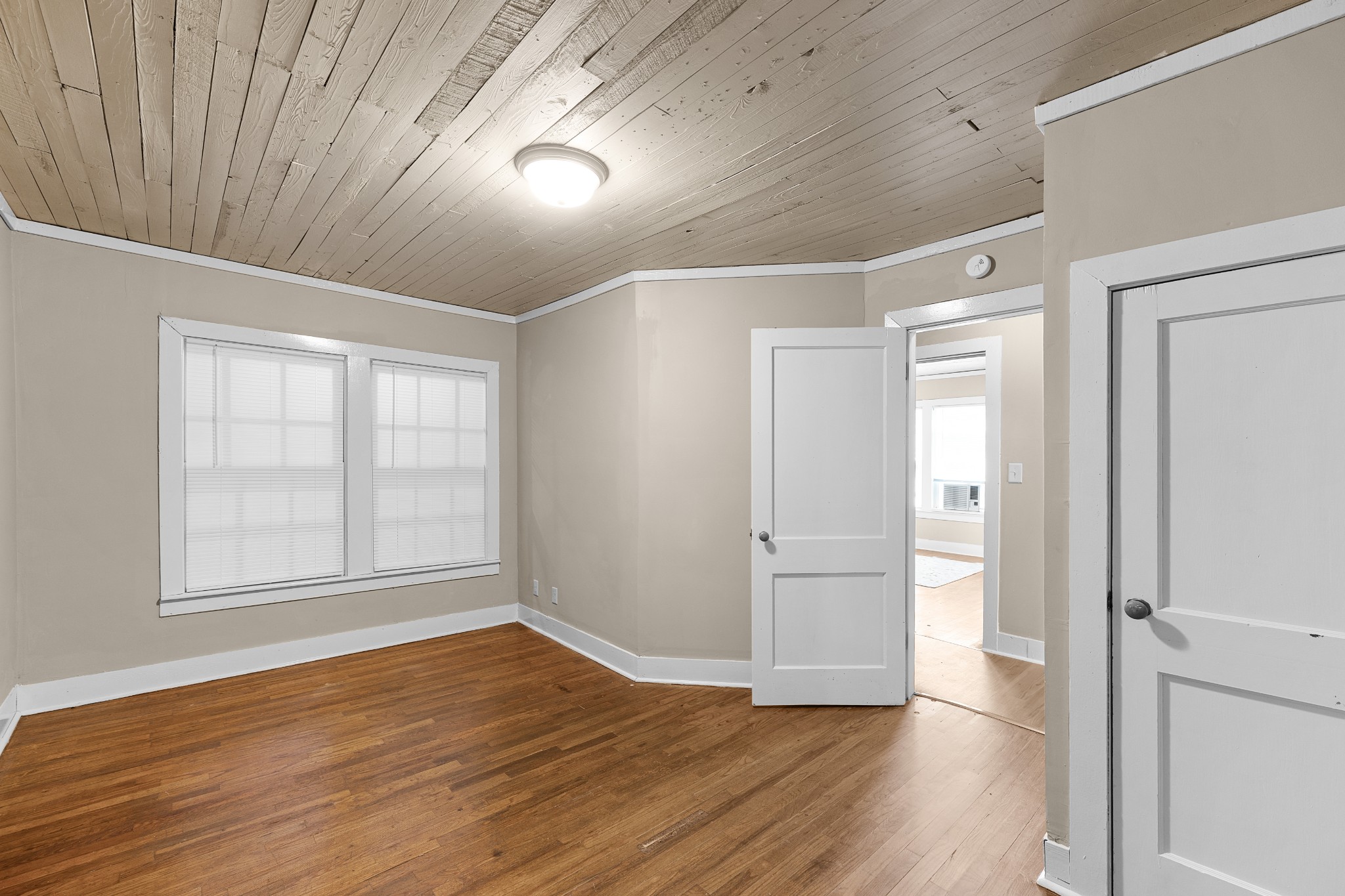 116 Summer Street Martin, TN 38237 - Photo 22 of 43 wooden floor in an empty room with a window