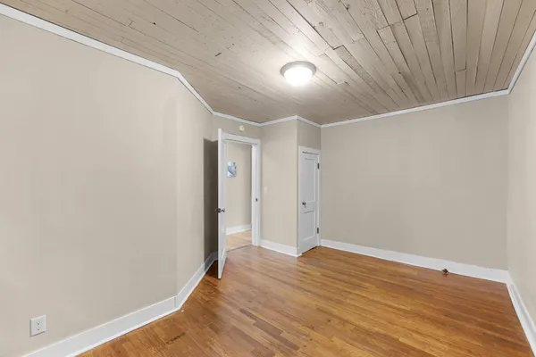a view of room with wooden floor