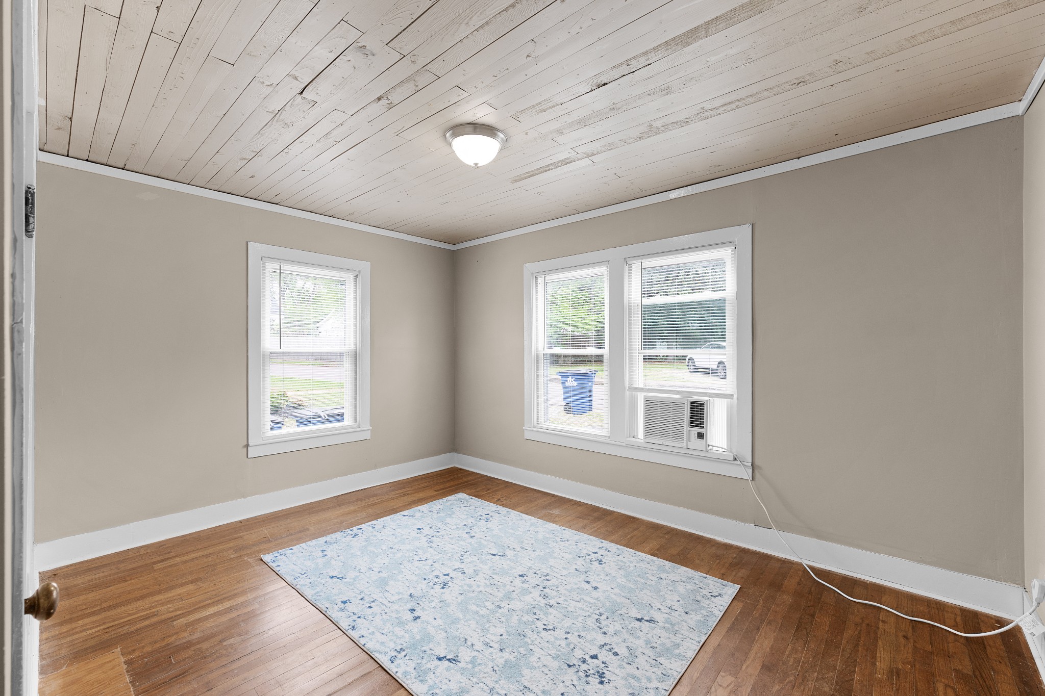 116 Summer Street Martin, TN 38237 - Photo 24 of 43 an empty room with wooden floor and windows