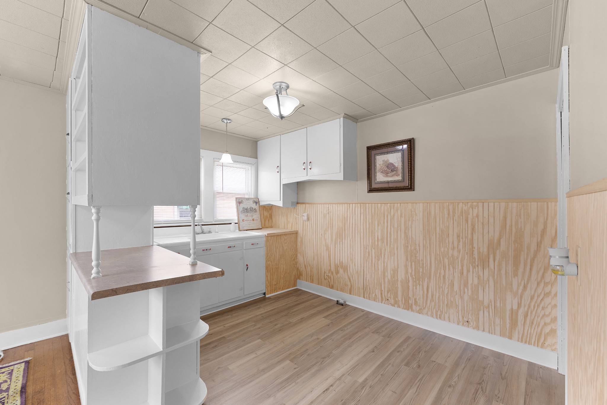 116 Summer Street Martin, TN 38237 - Photo 30 of 43 a kitchen with cabinets and wooden floor