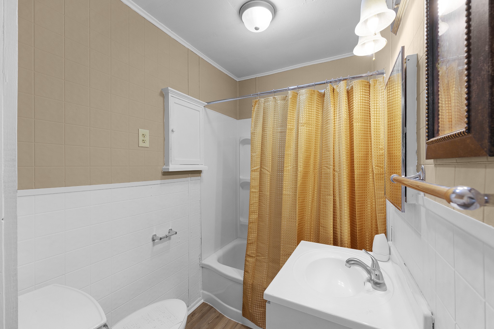 116 Summer Street Martin, TN 38237 - Photo 35 of 43 a bathroom with a sink a toilet and tub